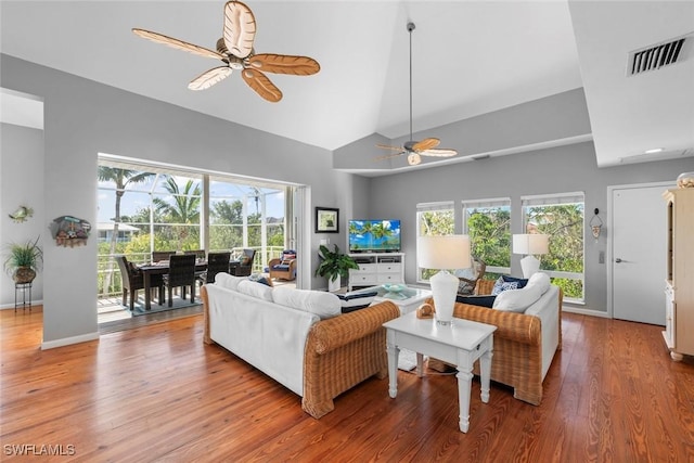 living room with hardwood / wood-style floors, plenty of natural light, and ceiling fan