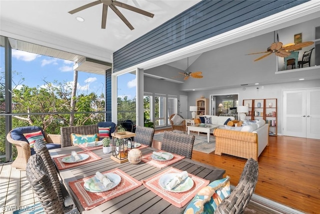 sunroom / solarium featuring vaulted ceiling and ceiling fan