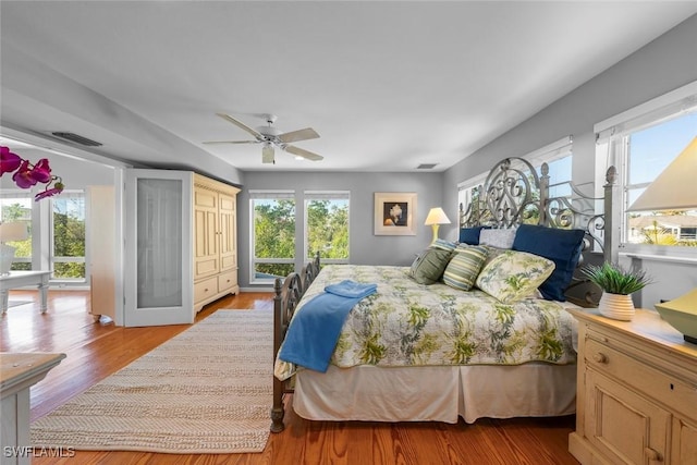 bedroom featuring light hardwood / wood-style floors and ceiling fan