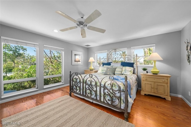 bedroom featuring ceiling fan and light hardwood / wood-style flooring