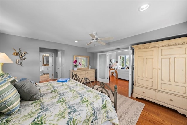 bedroom with light hardwood / wood-style flooring and ceiling fan