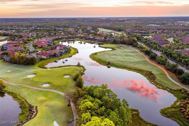 aerial view at dusk with a water view