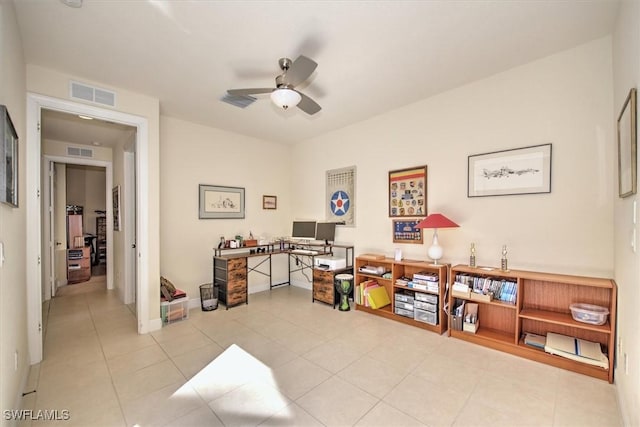 tiled office space with ceiling fan