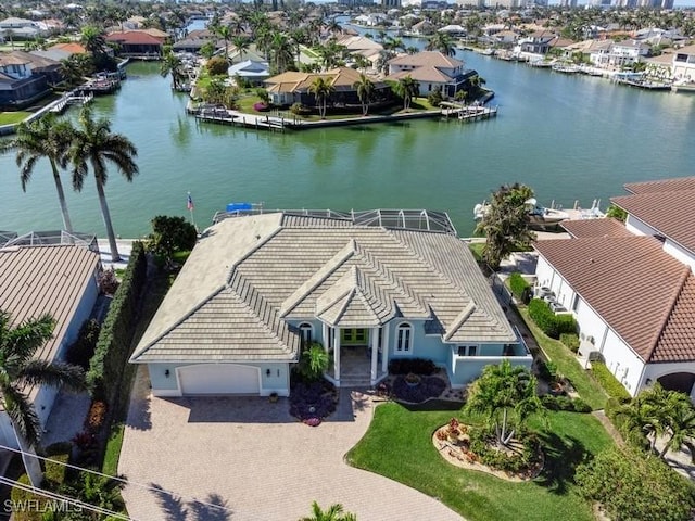 birds eye view of property featuring a water view