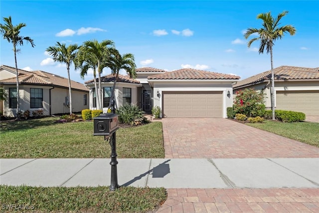 view of front facade with a garage and a front lawn