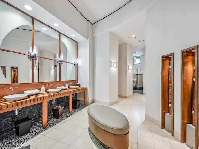 4931 Bonita Bay Blvd Unit 2103, Bonita Springs, FL 34134 - bathroom with recessed lighting, tile patterned floors, double vanity, and baseboards