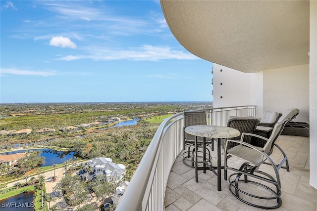 balcony featuring a water view