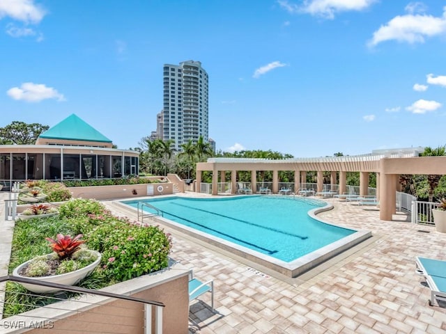 view of pool featuring a patio