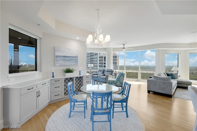 4931 Bonita Bay Blvd Unit 2103, Bonita Springs, FL 34134 - dining area featuring a chandelier, light wood-type flooring, recessed lighting, and a ceiling fan