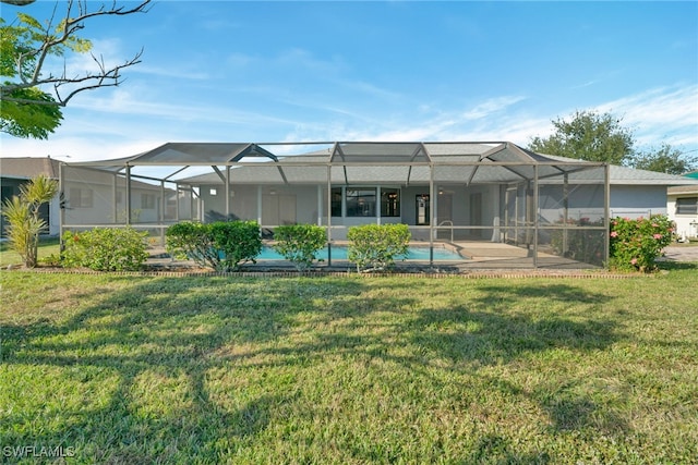 4145 SW 6th Pl, Cape Coral, FL 33914 - back of property featuring a yard, a patio area, and glass enclosure