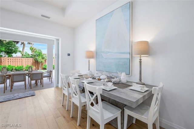 dining area with light hardwood / wood-style floors