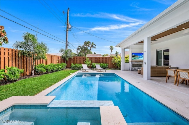 view of swimming pool featuring a lawn and a patio