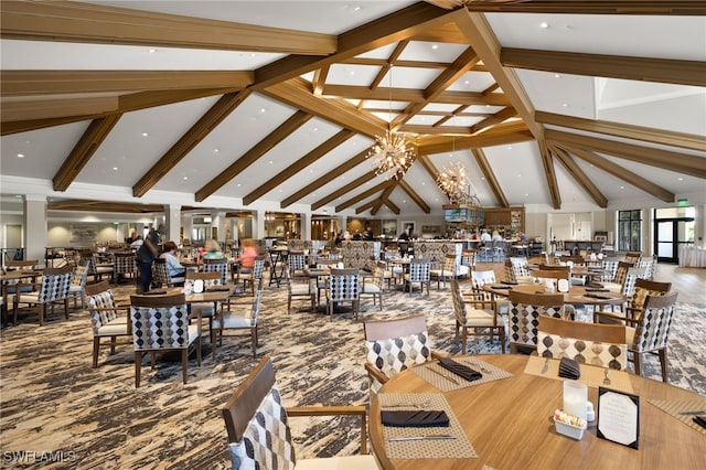 dining room featuring beamed ceiling, a notable chandelier, and high vaulted ceiling