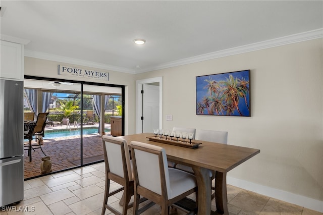 dining space featuring ornamental molding