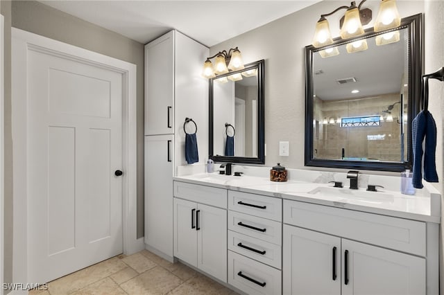 bathroom featuring vanity and a tile shower