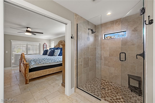 bathroom featuring crown molding, ceiling fan, and a shower with shower door