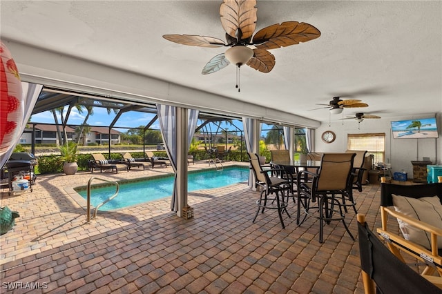 view of pool with a lanai and a patio area