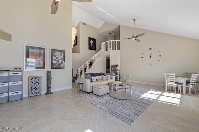 living room with ceiling fan and high vaulted ceiling