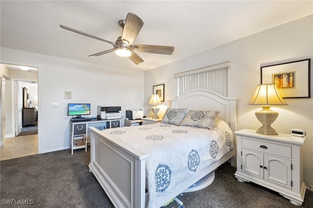 bedroom featuring dark carpet and ceiling fan