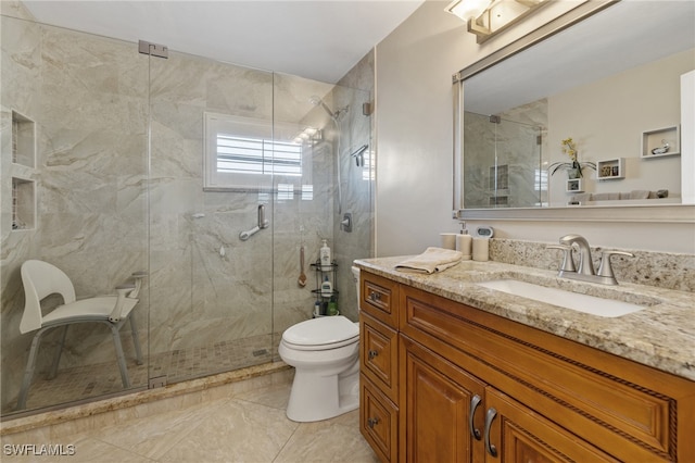 bathroom with vanity, toilet, and walk in shower