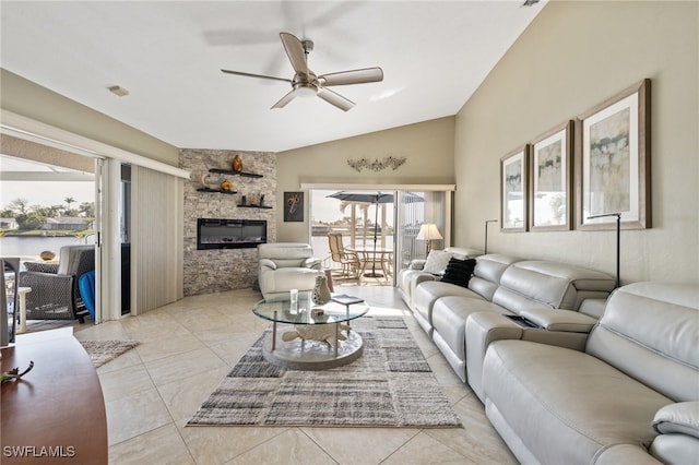 living room with lofted ceiling, a fireplace, plenty of natural light, and ceiling fan