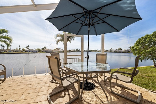 view of dock featuring a water view and a patio area