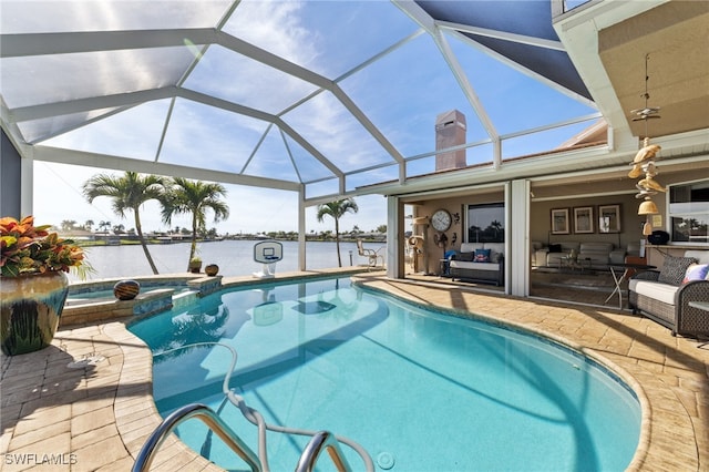 view of swimming pool featuring an in ground hot tub, a water view, glass enclosure, and a patio area