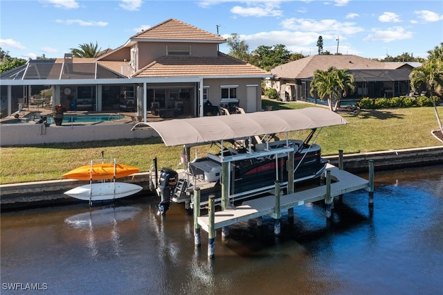 view of dock featuring a water view, glass enclosure, and a lawn