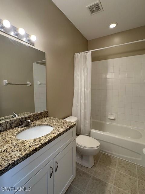 full bathroom with vanity, toilet, and shower / tub combo