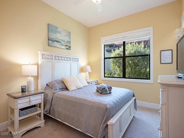 bedroom with ceiling fan and light colored carpet