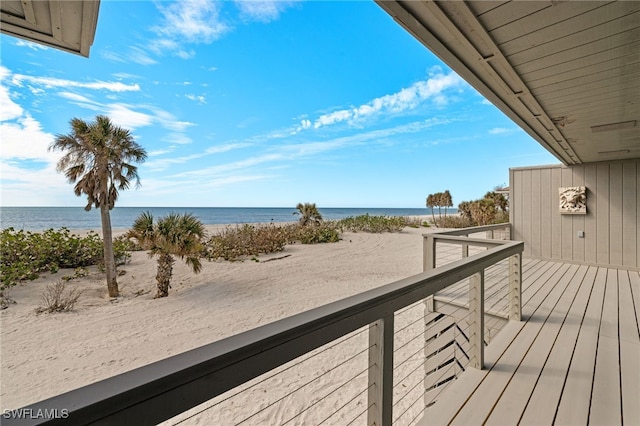 balcony with a beach view and a water view