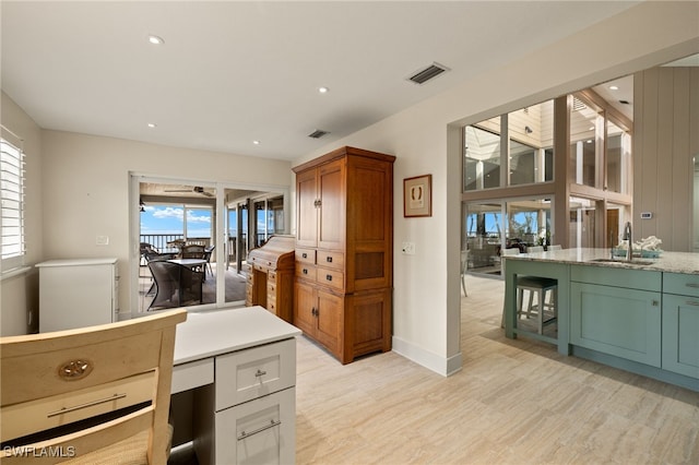 interior space with sink and light hardwood / wood-style flooring