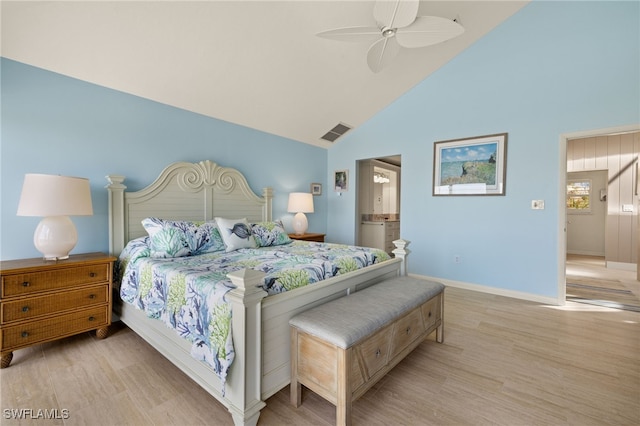 bedroom with ceiling fan, ensuite bathroom, high vaulted ceiling, and light wood-type flooring