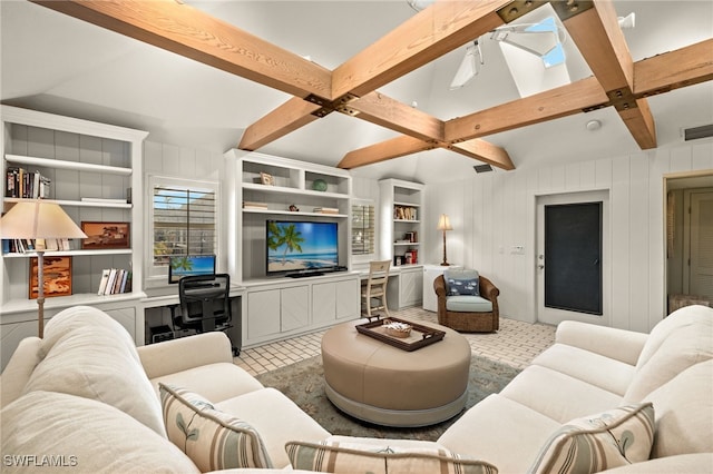 living room featuring beam ceiling and a skylight