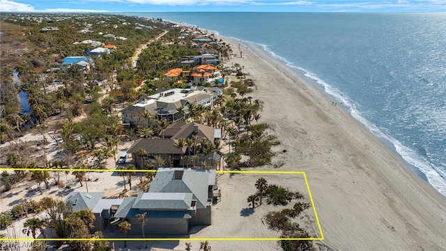 aerial view with a view of the beach and a water view