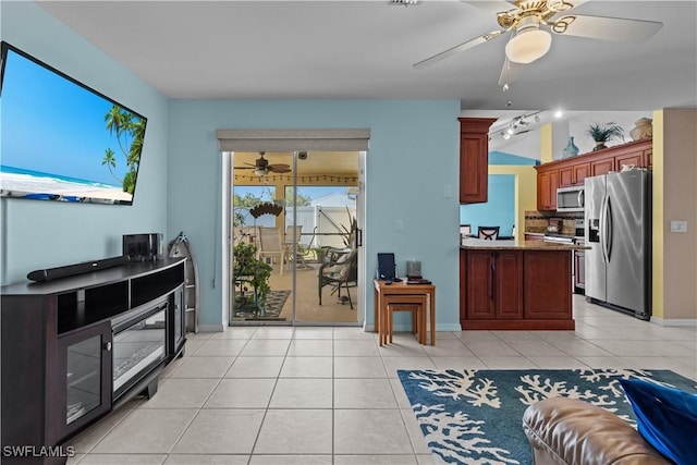 living room with light tile patterned floors and ceiling fan