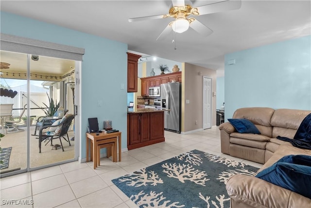 tiled living room with ceiling fan