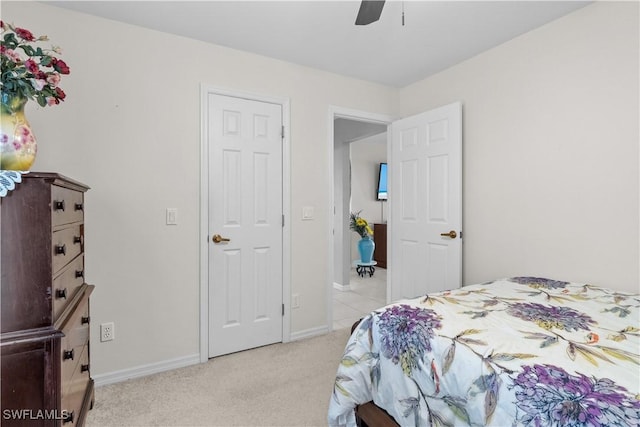 carpeted bedroom featuring ceiling fan