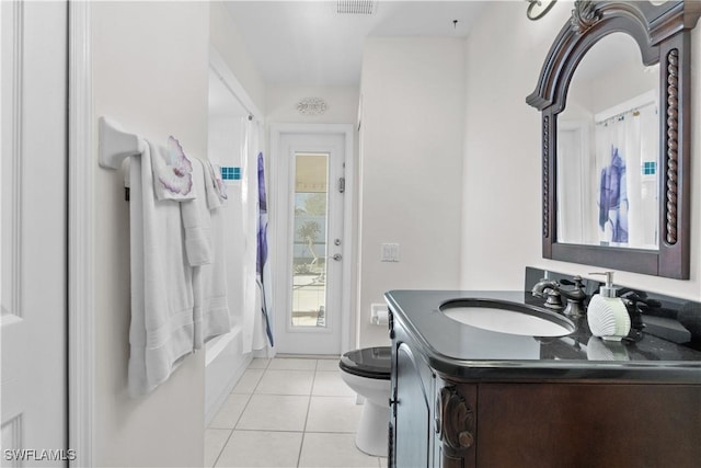 full bathroom with tile patterned flooring, vanity, toilet, and shower / bath combo with shower curtain