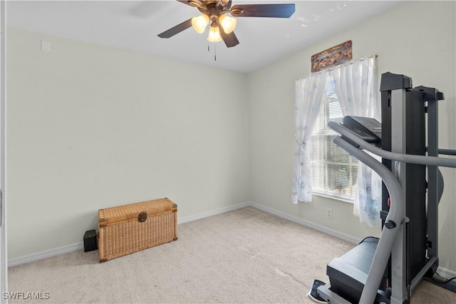 workout room with light carpet and ceiling fan