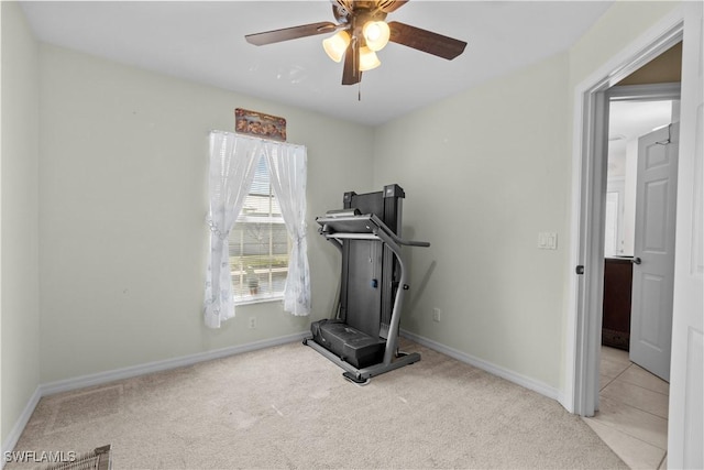 exercise room with light carpet and ceiling fan