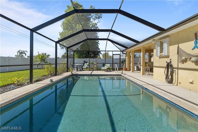 view of pool with a lanai and a patio area