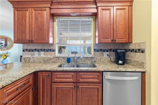 kitchen with stainless steel dishwasher, light stone countertops, sink, and decorative backsplash