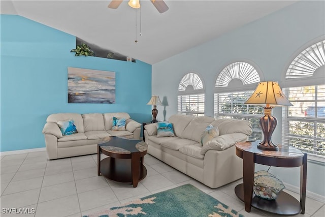 living room with ceiling fan, vaulted ceiling, and light tile patterned floors