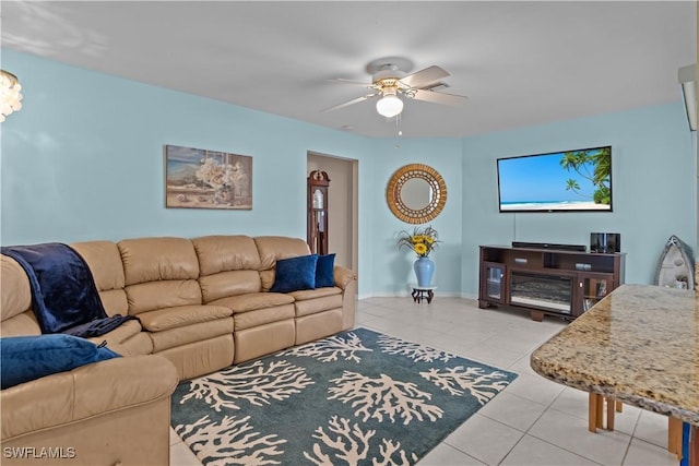 tiled living room featuring ceiling fan