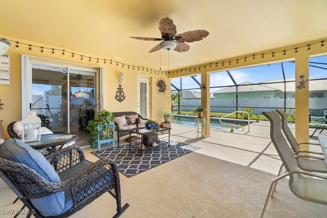 view of patio / terrace featuring a fenced in pool, ceiling fan, an outdoor hangout area, and glass enclosure