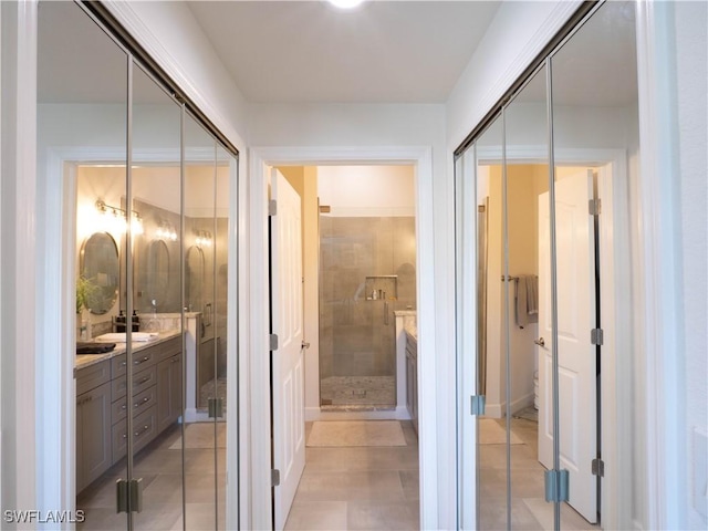 bathroom featuring walk in shower and vanity