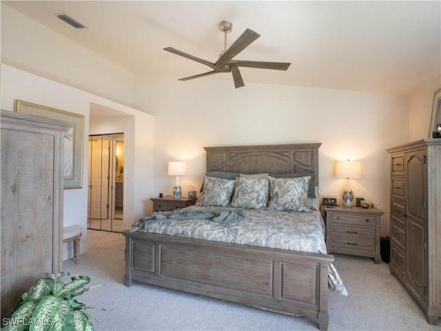 carpeted bedroom featuring vaulted ceiling and ceiling fan