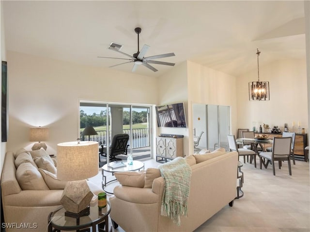 living room featuring ceiling fan with notable chandelier