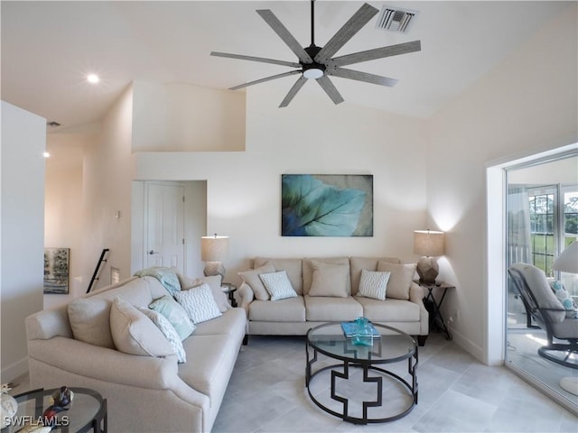 living room featuring high vaulted ceiling and ceiling fan